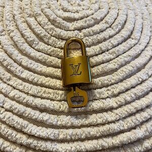 LV lock and key. gold tone.